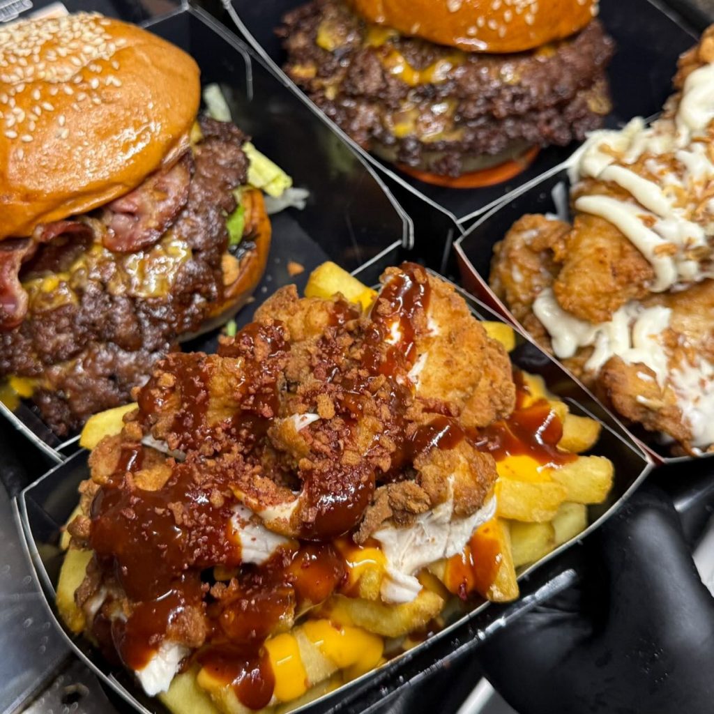 Burgers and loaded fries in truck boxes